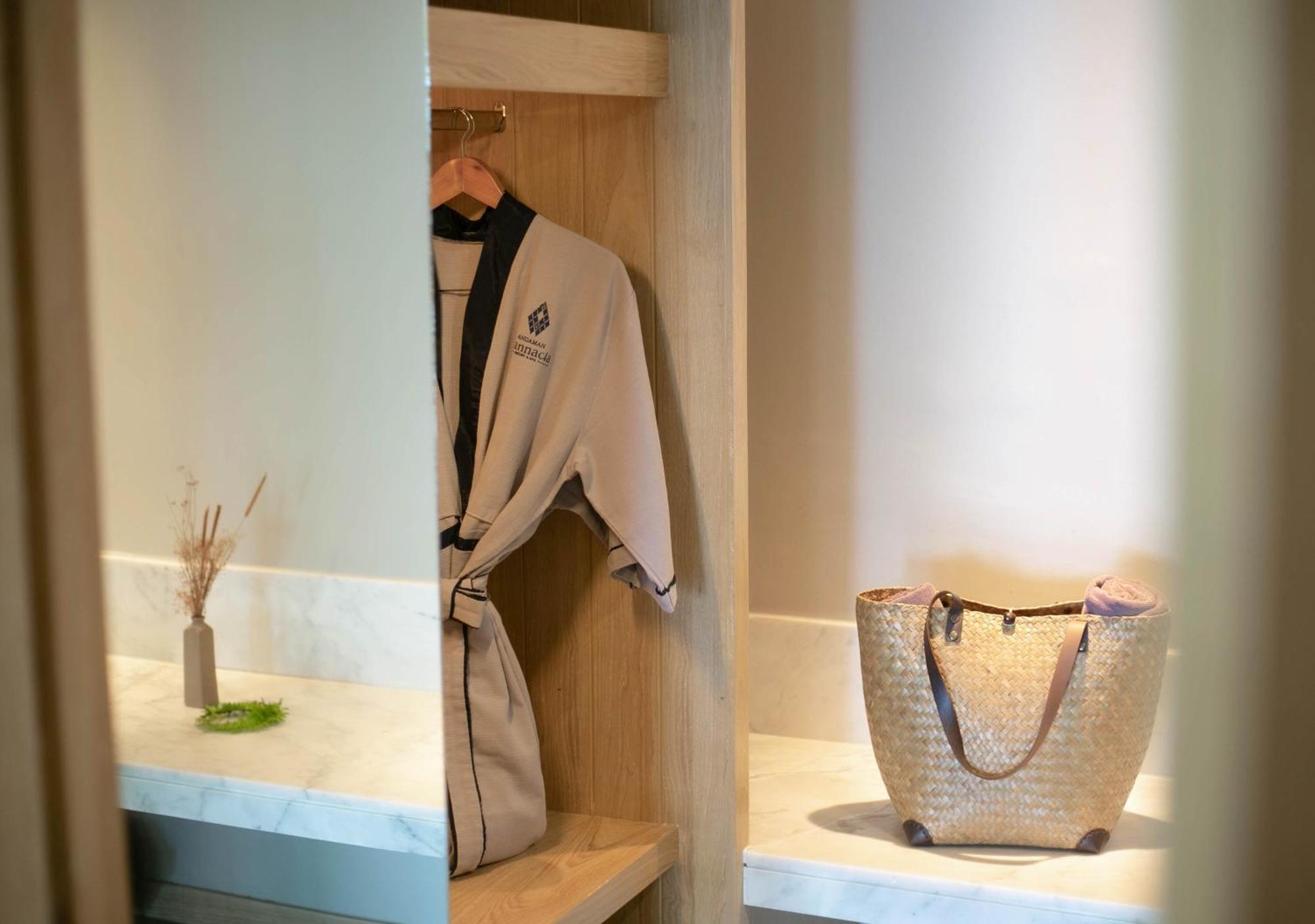Andaman Cannacia Resort & Spa - Sha Extra Plus Plage de Kata Extérieur photo A bathrobe hanging in a closet